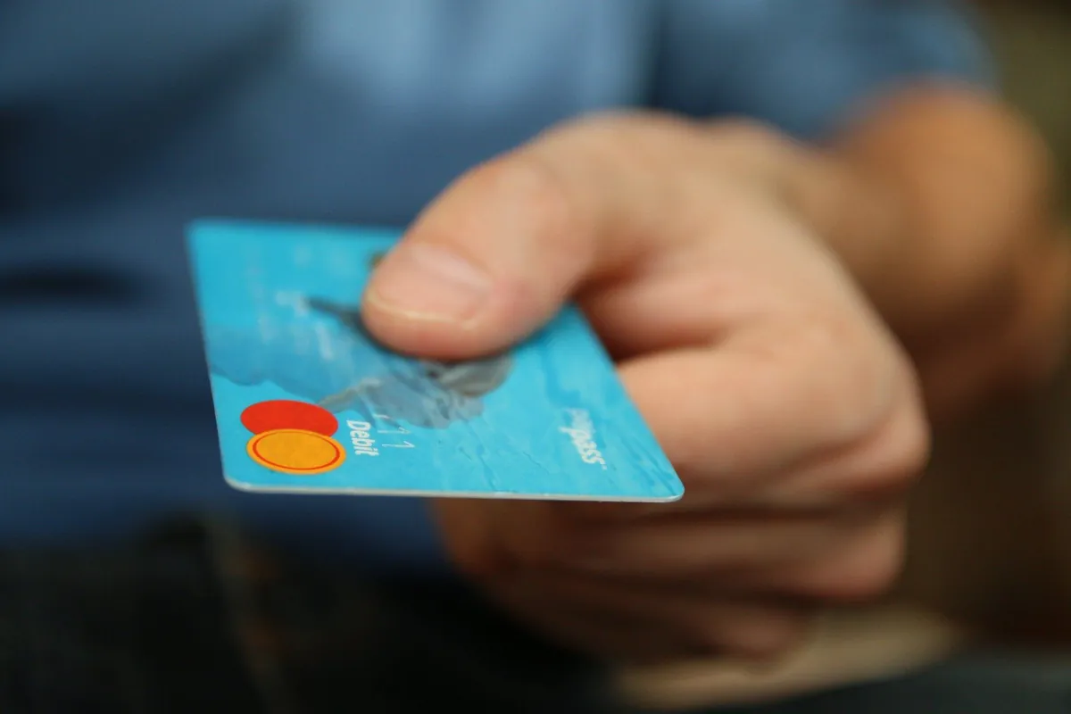 Bank card and cash representing solar finance options